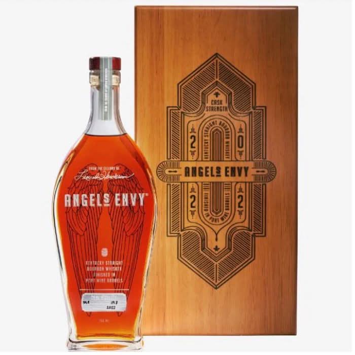 A bottle of Angels Envy Cask Strength 2022 Port Finished Bourbon Whiskey, with elegant packaging and a rich amber color reflecting the high-quality cask strength release.
