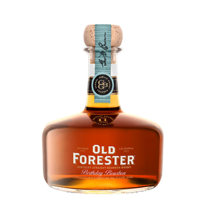 A bottle of Old Forester Birthday Bourbon – 2022 Release, featuring its signature round decanter-style design, deep amber whiskey, and a limited-edition label honoring George Garvin Brown.