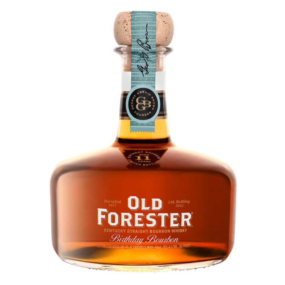 A bottle of Old Forester Birthday Bourbon – 2022 Release, featuring its signature round decanter-style design, deep amber whiskey, and a limited-edition label honoring George Garvin Brown.