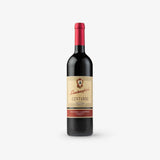 Red wine bottle with a visible label on a white background