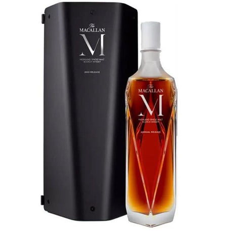 Macallan M Decanter 2022 Release Scotch Whisky in a Lalique crystal decanter, showcasing its rich natural color and intricate design