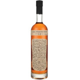 Bottle of Rare Perfection 14 Year Bourbon, showcasing its elegant label design, set against a rustic background to emphasize its Canadian origin.