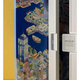 Fridge with a colorful cityscape design on one door and 'The Macallan' branding on the other.