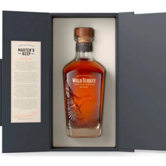 A bottle of Wild Turkey Master's Keep One Kentucky Straight Bourbon, showcasing its elegant label and amber color, reflecting the perfect blend of mid-aged and 14-year-old whiskey.