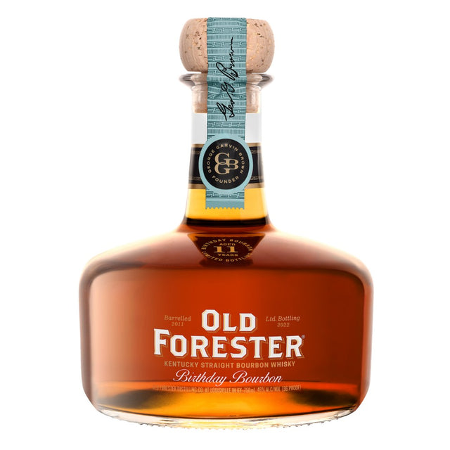 A bottle of Old Forester Birthday Bourbon – 2022 Release, featuring its signature round decanter-style design, deep amber whiskey, and a limited-edition label honoring George Garvin Brown.
